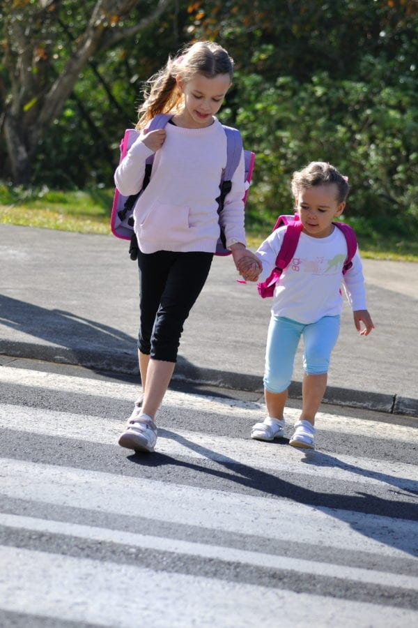 two children holding  hands