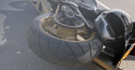 motorcycle on the ground following a crash