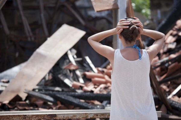 Woman reacting to damaged property