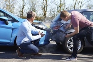 Two Men Looking at Damages after an Accident