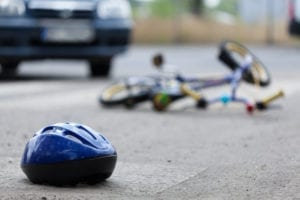 Fallen Bicycle and Helmet on Street